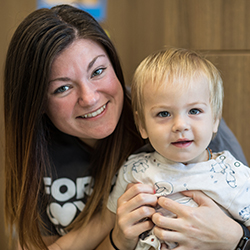 teacher with toddler on her lap