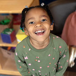 preschool girl smiling at the camera