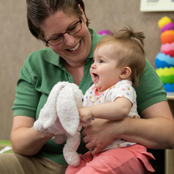 teacher holding baby